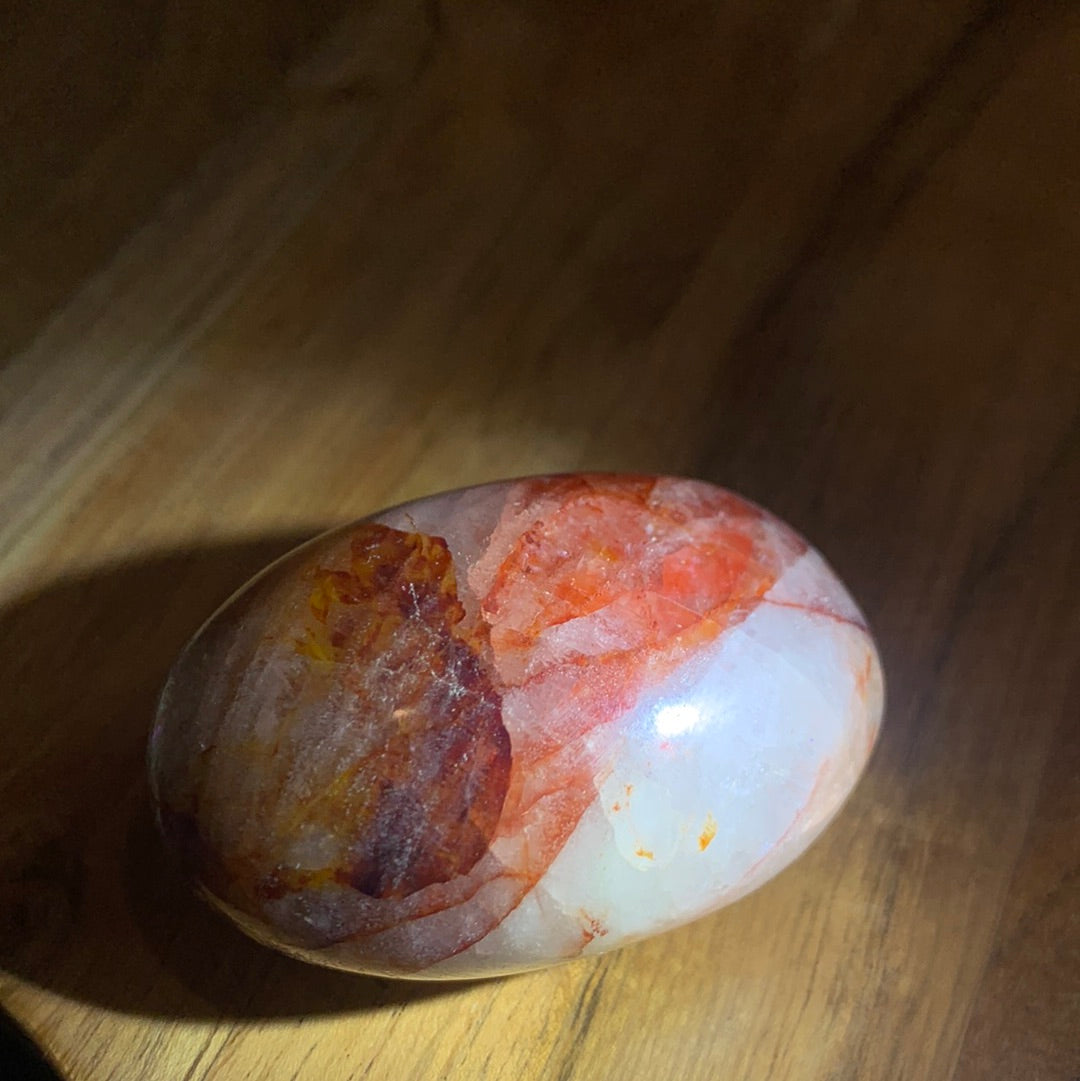 FIRE QUARTZ EGG SHAPED PALMSTONE