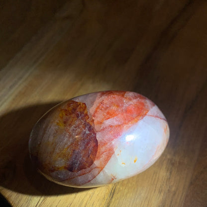FIRE QUARTZ EGG SHAPED PALMSTONE