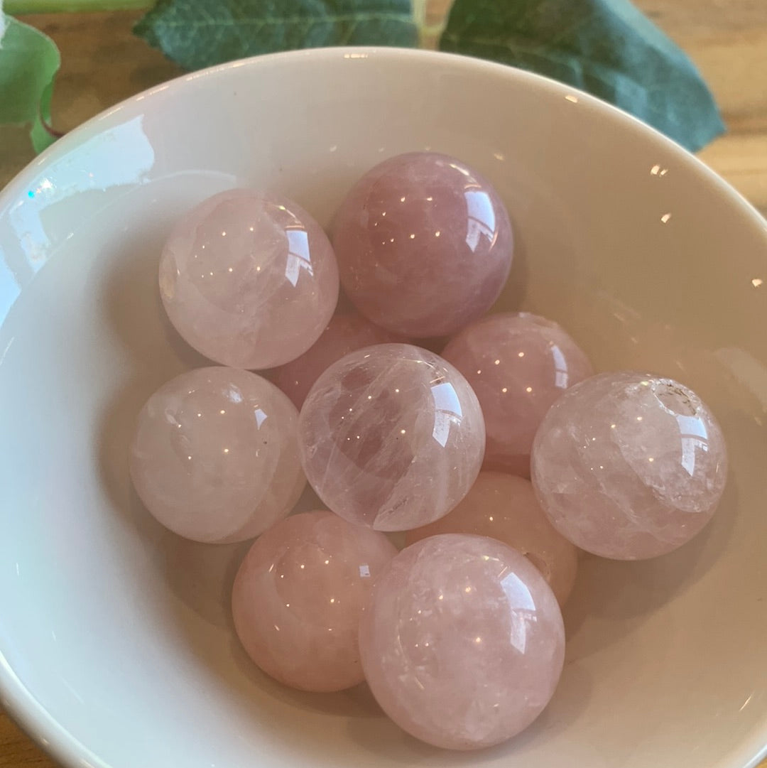 ROSE QUARTZ SPHERES SMALL (EACH ONE HAS HOLE HALFWAY DRILLED IN