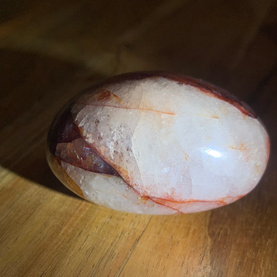 FIRE QUARTZ EGG SHAPED PALMSTONE