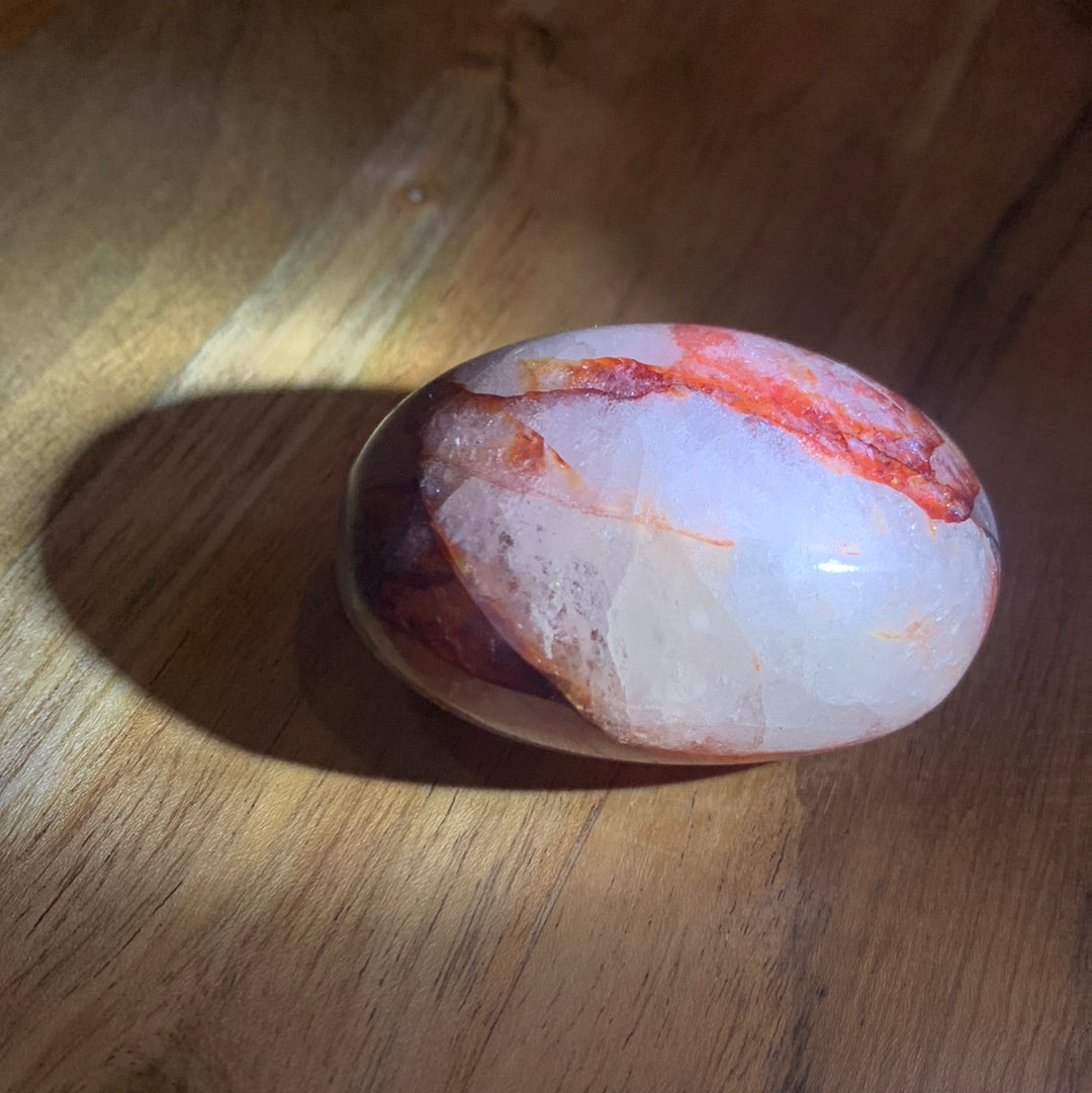 FIRE QUARTZ EGG SHAPED PALMSTONE