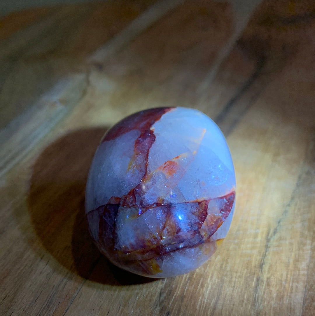 FIRE QUARTZ EGG SHAPED PALMSTONE