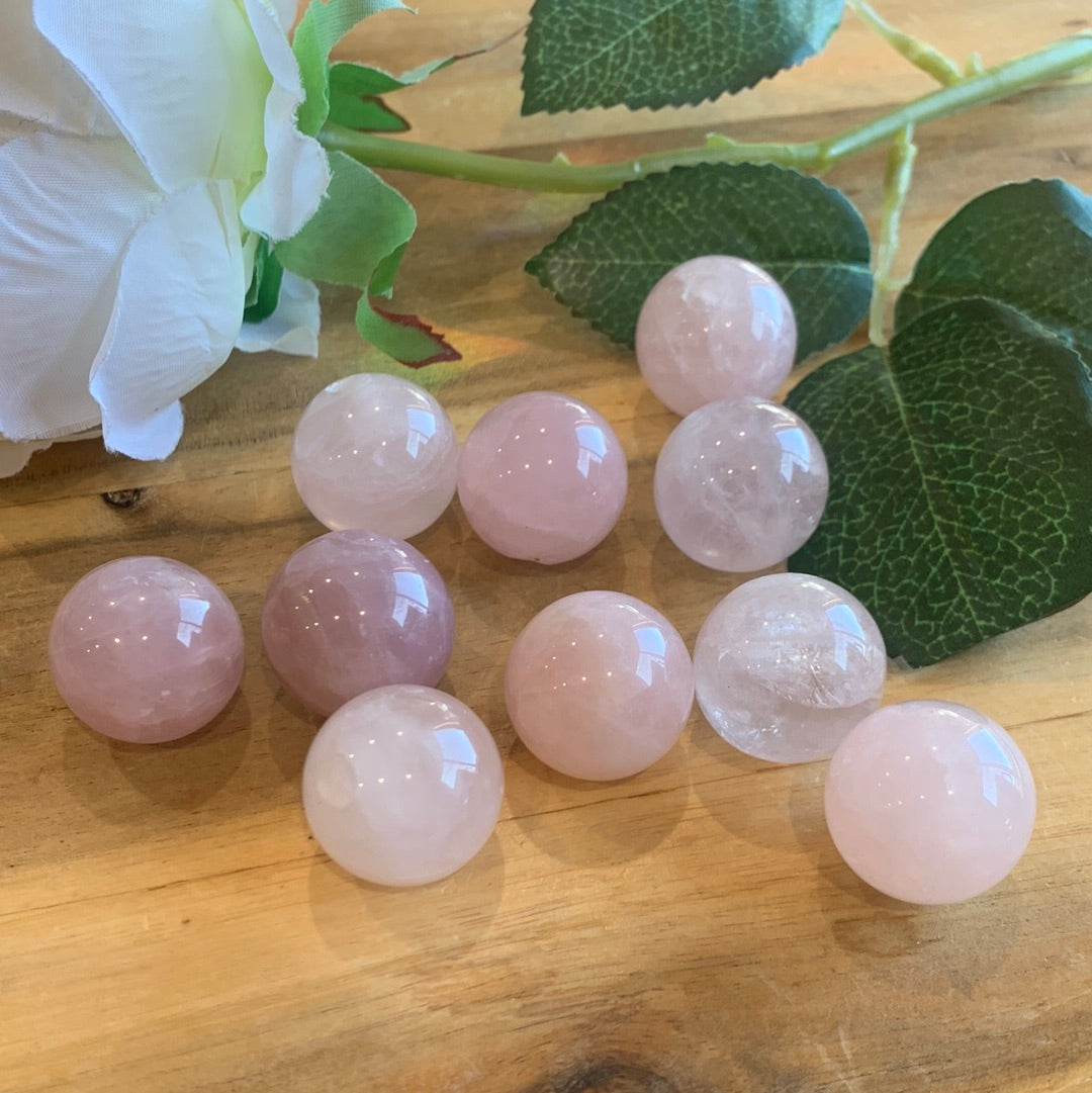 ROSE QUARTZ SPHERES SMALL (EACH ONE HAS HOLE HALFWAY DRILLED IN