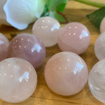 ROSE QUARTZ SPHERES SMALL (EACH ONE HAS HOLE HALFWAY DRILLED IN