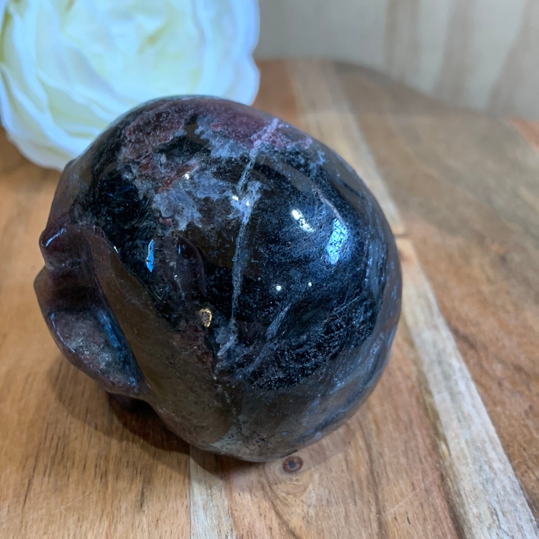 ASTROPHYLITE AND GARNET SKULL