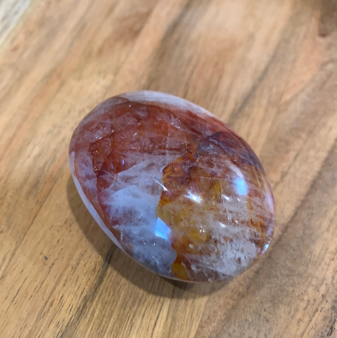 FIRE QUARTZ EGG SHAPED PALMSTONE