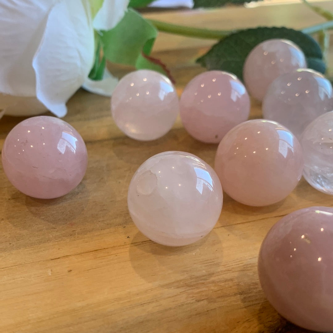 ROSE QUARTZ SPHERES SMALL (EACH ONE HAS HOLE HALFWAY DRILLED IN