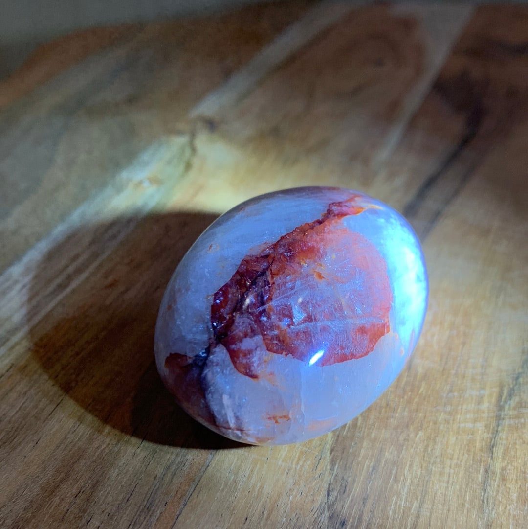 FIRE QUARTZ EGG SHAPED PALMSTONE