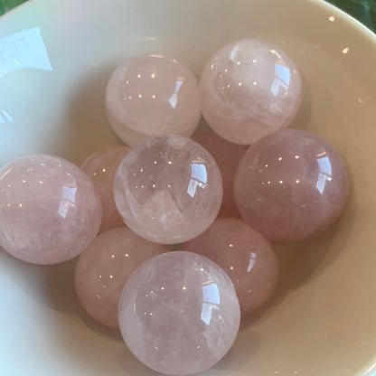 ROSE QUARTZ SPHERES SMALL (EACH ONE HAS HOLE HALFWAY DRILLED IN