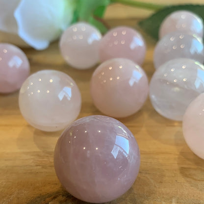 ROSE QUARTZ SPHERES SMALL (EACH ONE HAS HOLE HALFWAY DRILLED IN