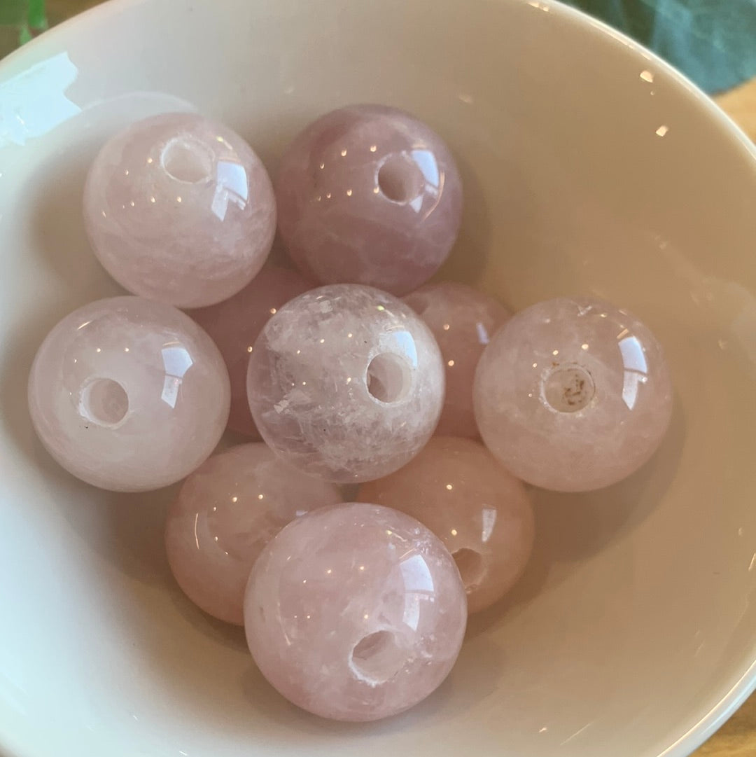 ROSE QUARTZ SPHERES SMALL (EACH ONE HAS HOLE HALFWAY DRILLED IN