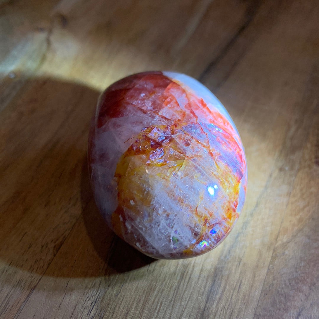 FIRE QUARTZ EGG SHAPED PALMSTONE