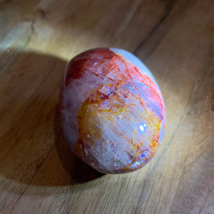 FIRE QUARTZ EGG SHAPED PALMSTONE